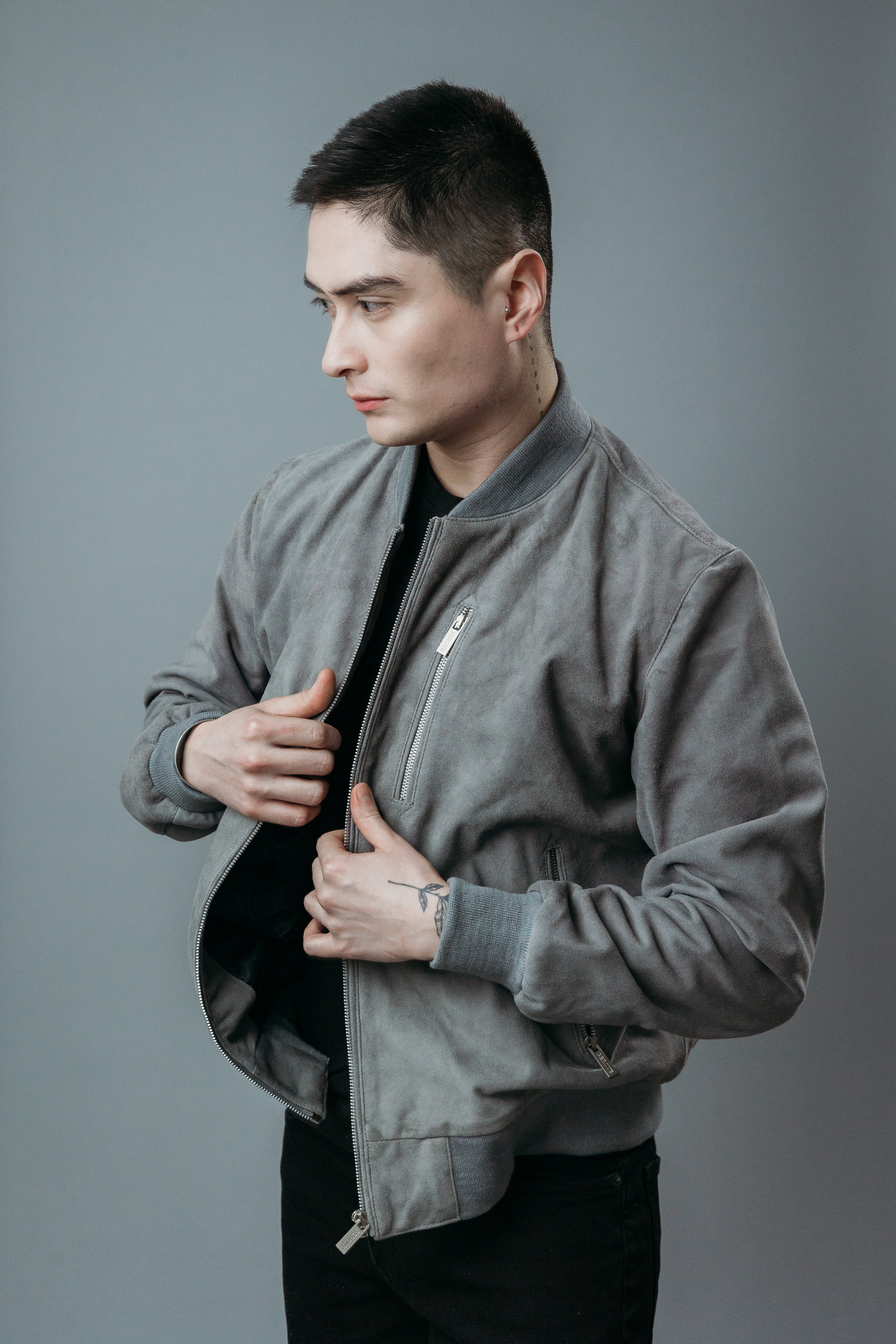 Men's Bomber Jacket made with Suede Goat Leather in Dark Gray Colour. Inner Lining is Silk Satin Material in Black Colour. It has Zipper and Matte Silver Trim.