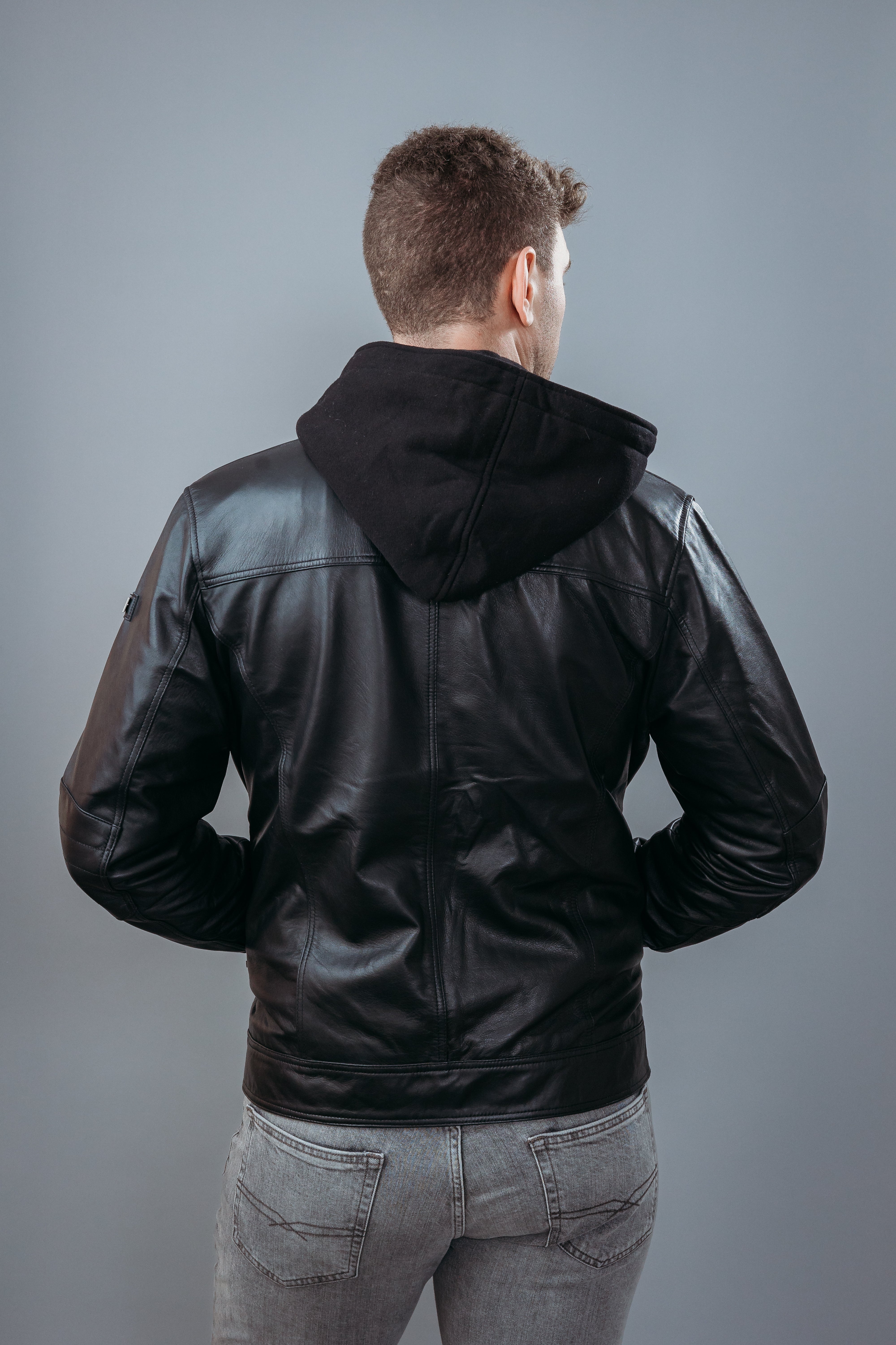 Men's Café Racer Style Hooded Jacket made with Semi Aniline Sheep Leather in Black Colour. Inner Lining is Silk Satin Material in Black Colour. It has Zipper and Gun Metal Trim.