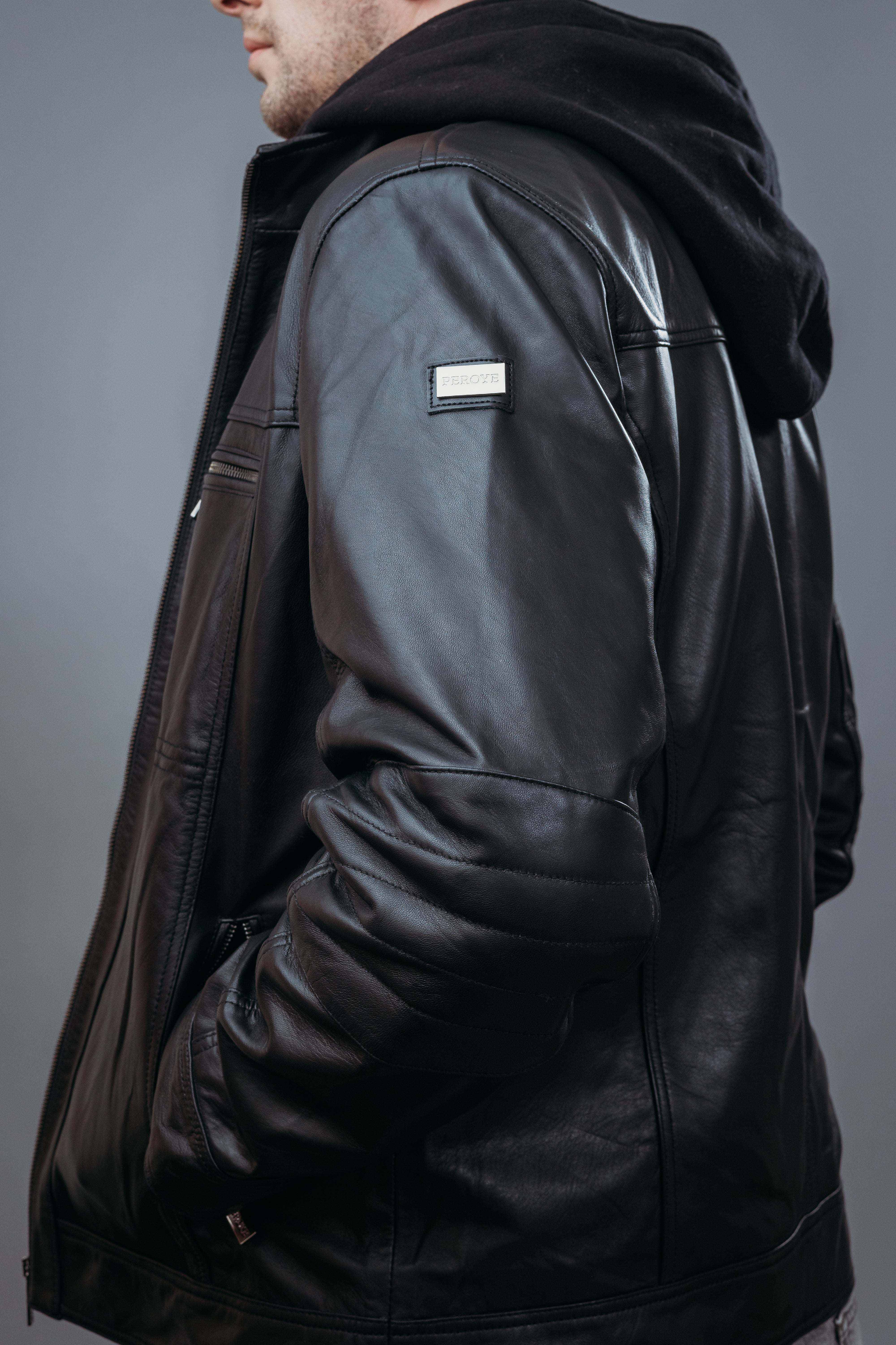 Men's Café Racer Style Hooded Jacket made with Semi Aniline Sheep Leather in Black Colour. Inner Lining is Silk Satin Material in Black Colour. It has Zipper and Gun Metal Trim.