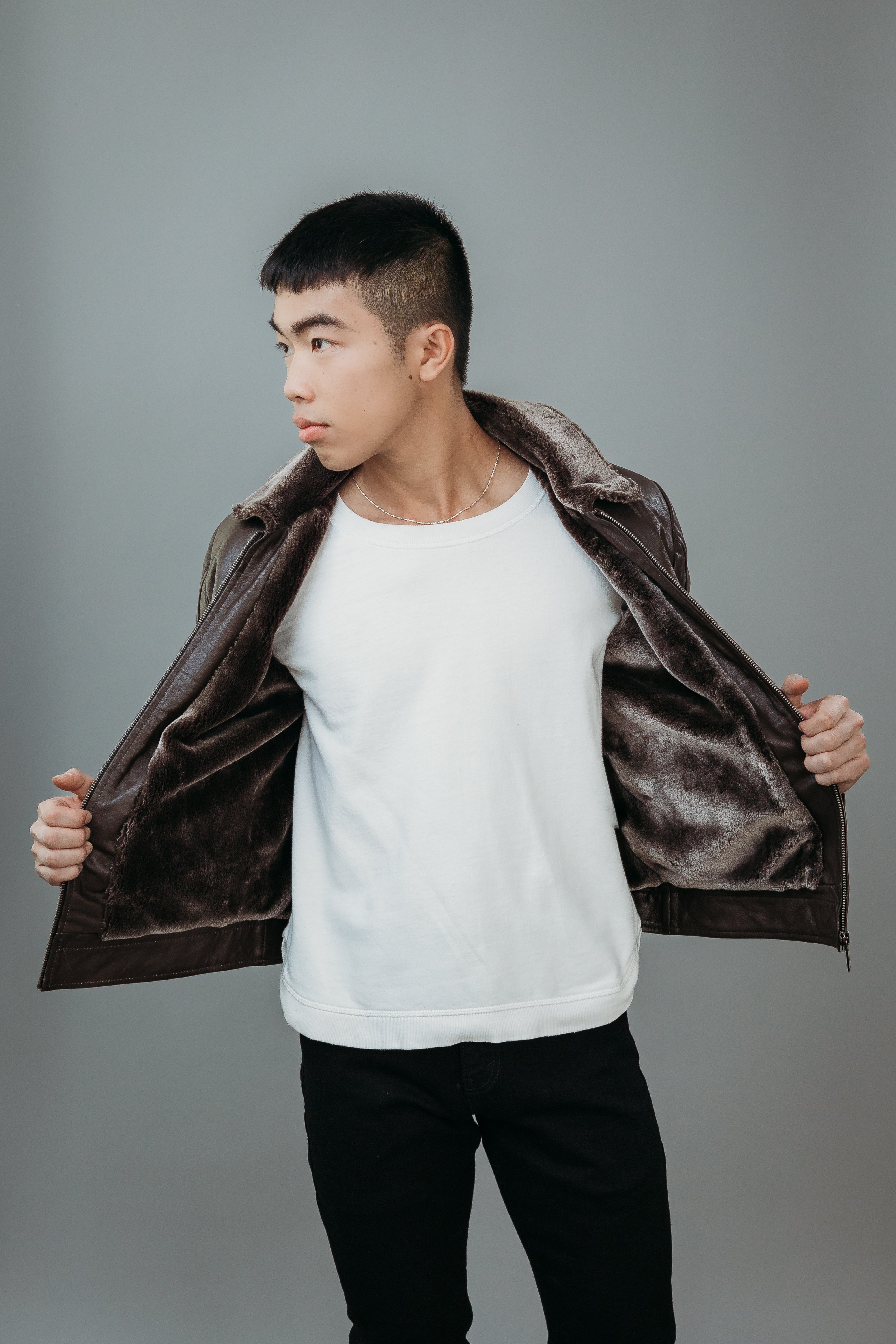 Men's Faux Fur Jacket made with Semi Aniline Sheep Leather in Dark Brown Colour. Inner Lining is Faux Fur Material in Dark Brown Colour. It has Zipper and Gun Metal Trim.