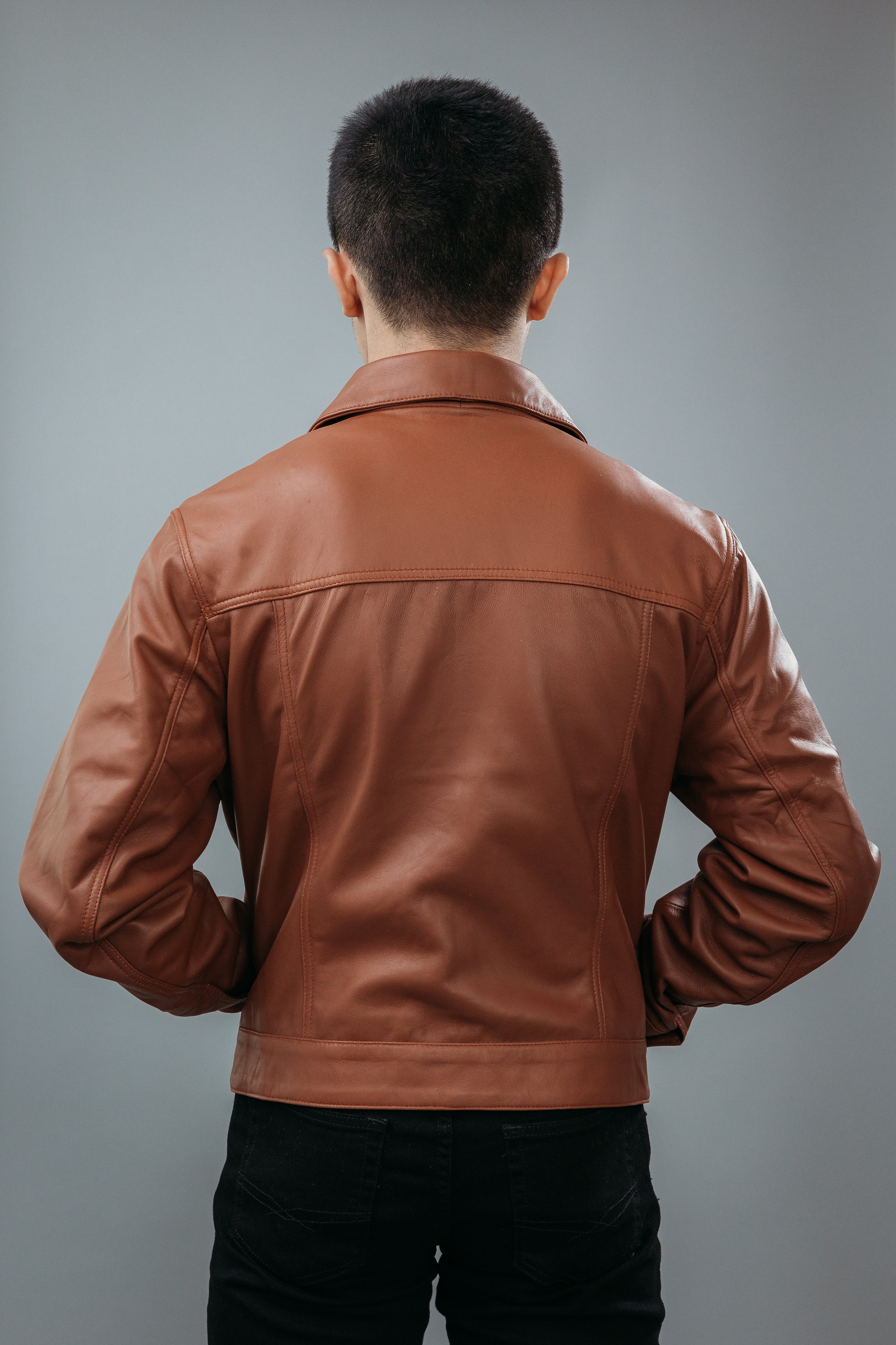 Men's Jeans Style Jacket made with Sheep Top Grain Nappa Leather in Brown Colour. Inner Lining is Silk Satin Material in Brown Colour. It has Brown Plastic Buttons.