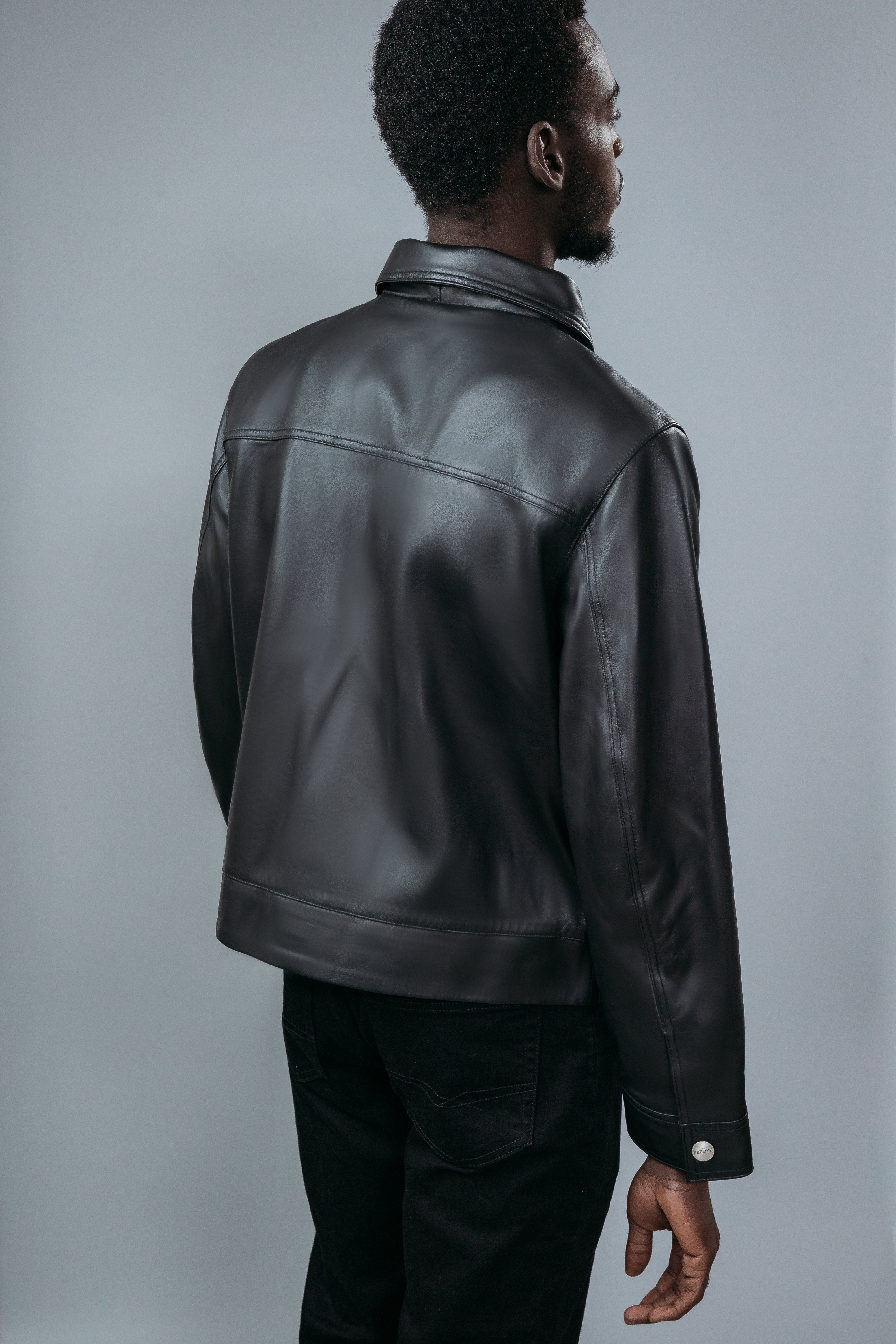 Men's Shirt Collar Style Jacket made with Semi Aniline Sheep Leather in Black Colour. Inner Lining is Silk Satin Material in Black Colour. It has Zipper and Gun Metal Trim.