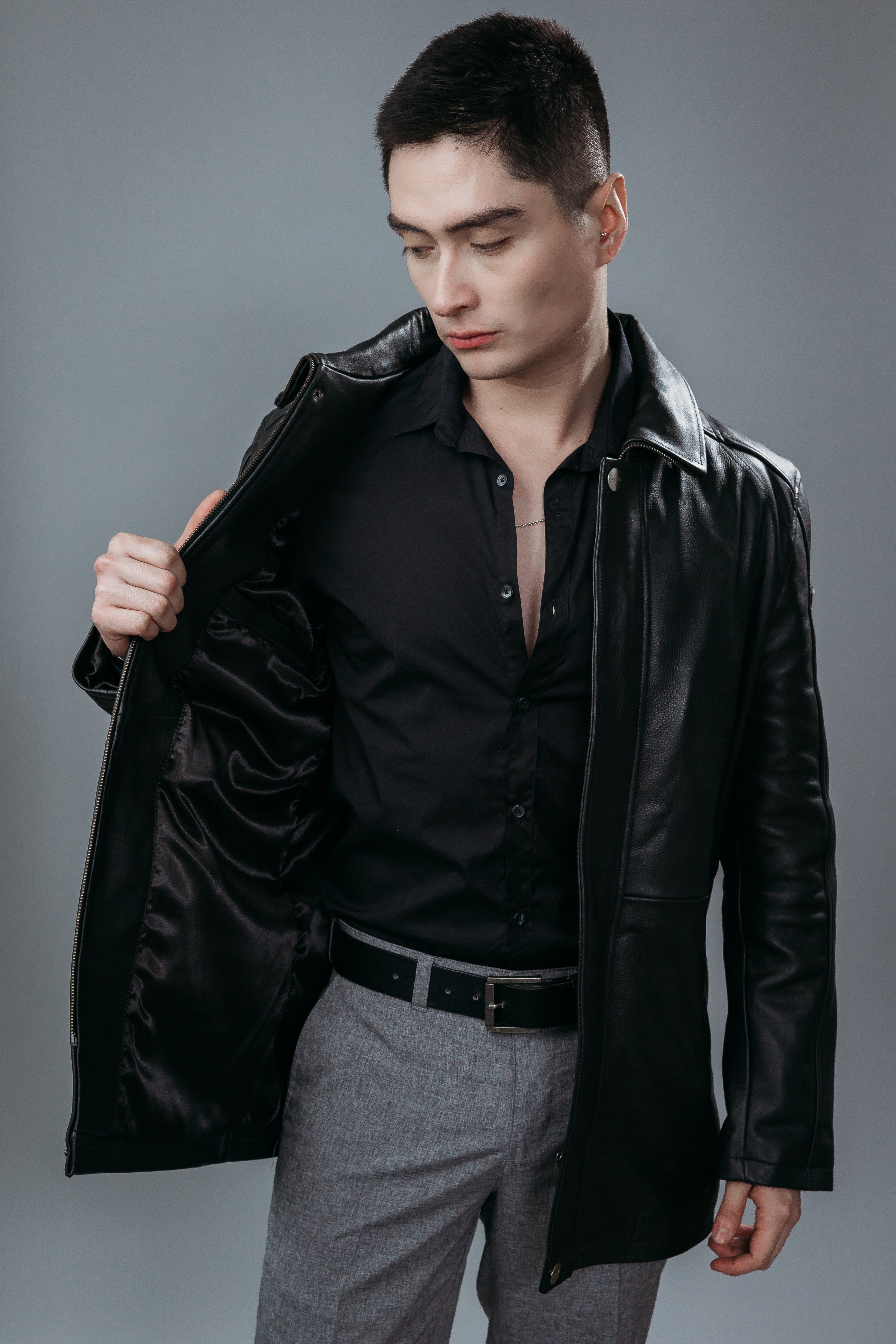 Men's Three Quarter Coat made with Natural Cow Leather in Black Colour. Inner Lining is Silk Satin Material in Black Colour. It has Zipper and Gun Metal Trim.