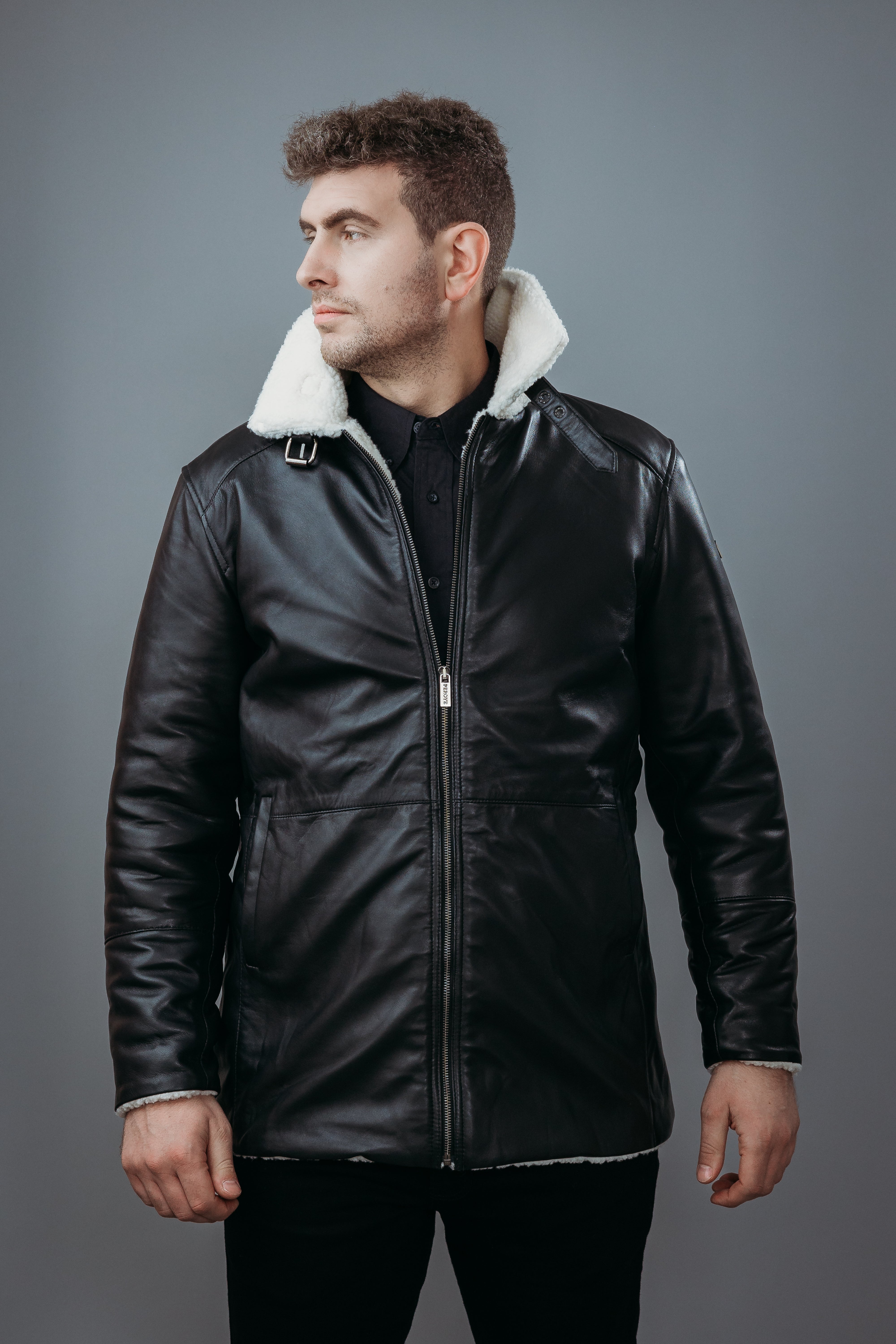 Men's Three Quarter Style Faux Fur Jacket made with Semi Aniline Sheep Leather in Black Colour. Inner Lining is Faux Fur Material in White Colour. It has Zipper and Gun Metal Trim.