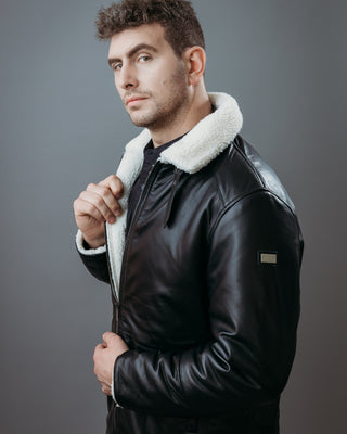 Men's Three Quarter Style Faux Fur Jacket made with Semi Aniline Sheep Leather in Black Colour. Inner Lining is Faux Fur Material in White Colour. It has Zipper and Gun Metal Trim.