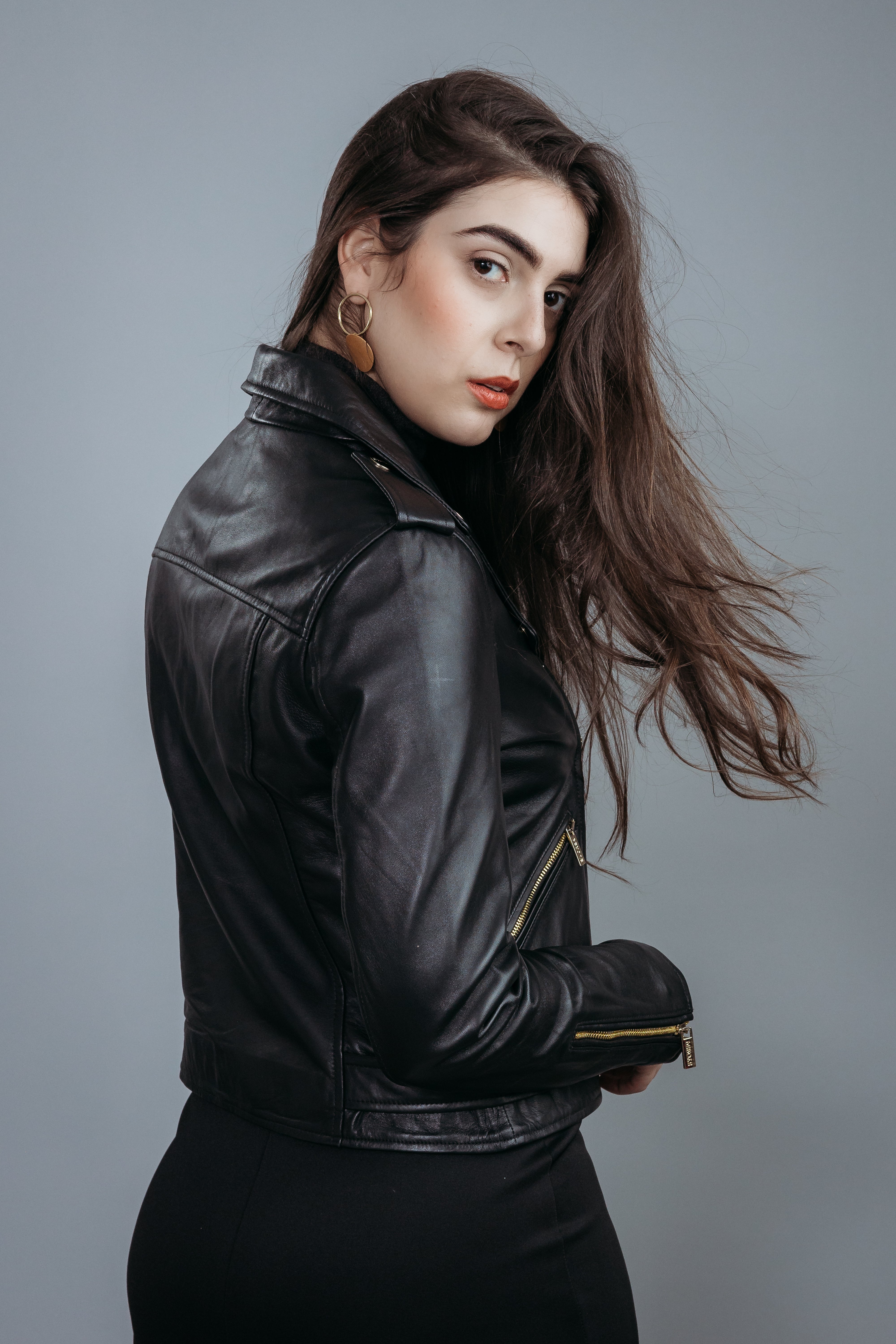 Women's Biker Jacket made with Semi Aniline Sheep Leather in Black Colour. Inner Lining is Silk Satin Material in Black Colour. It has Zipper and Golden Trim.