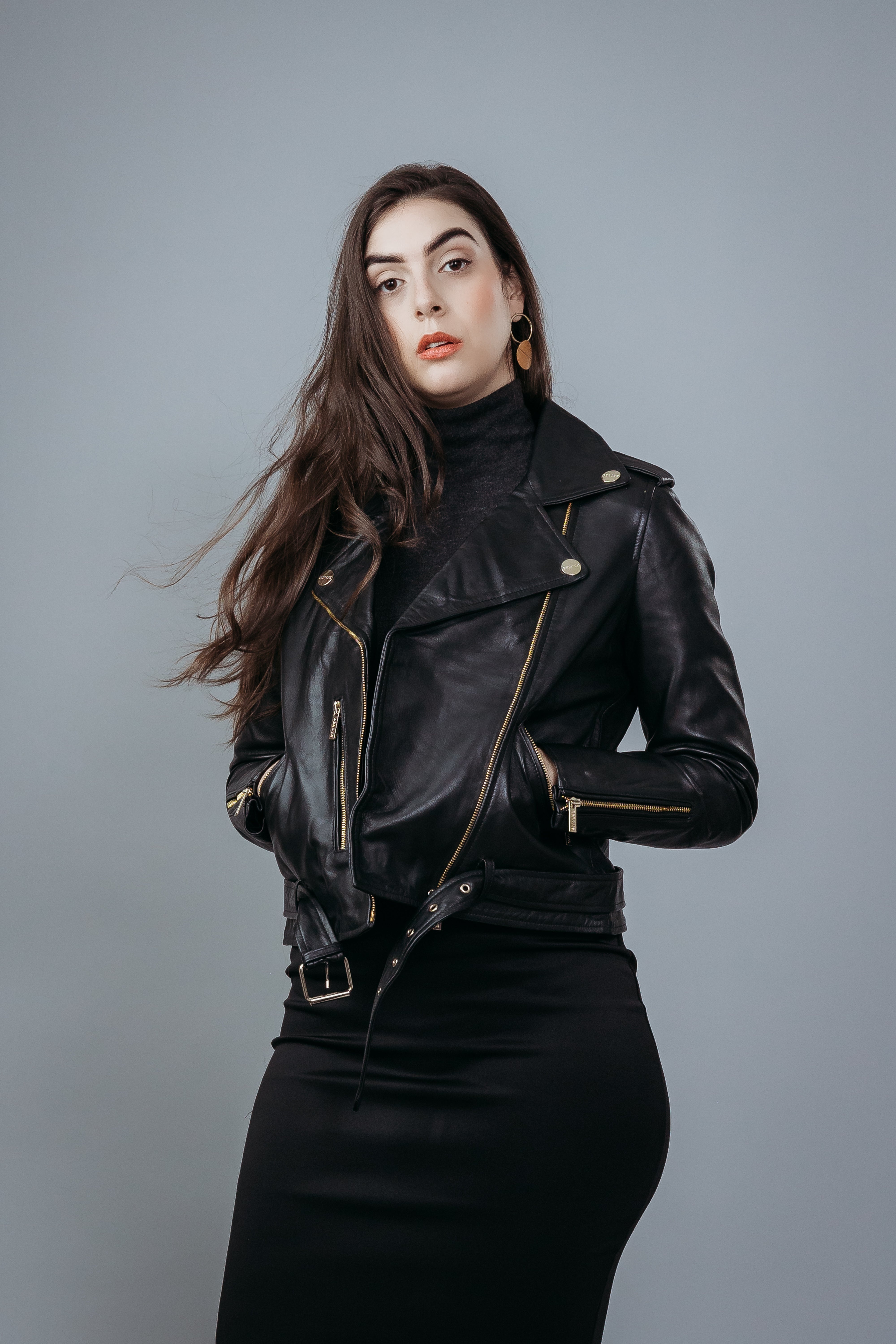 Women's Biker Jacket made with Semi Aniline Sheep Leather in Black Colour. Inner Lining is Silk Satin Material in Black Colour. It has Zipper and Golden Trim.