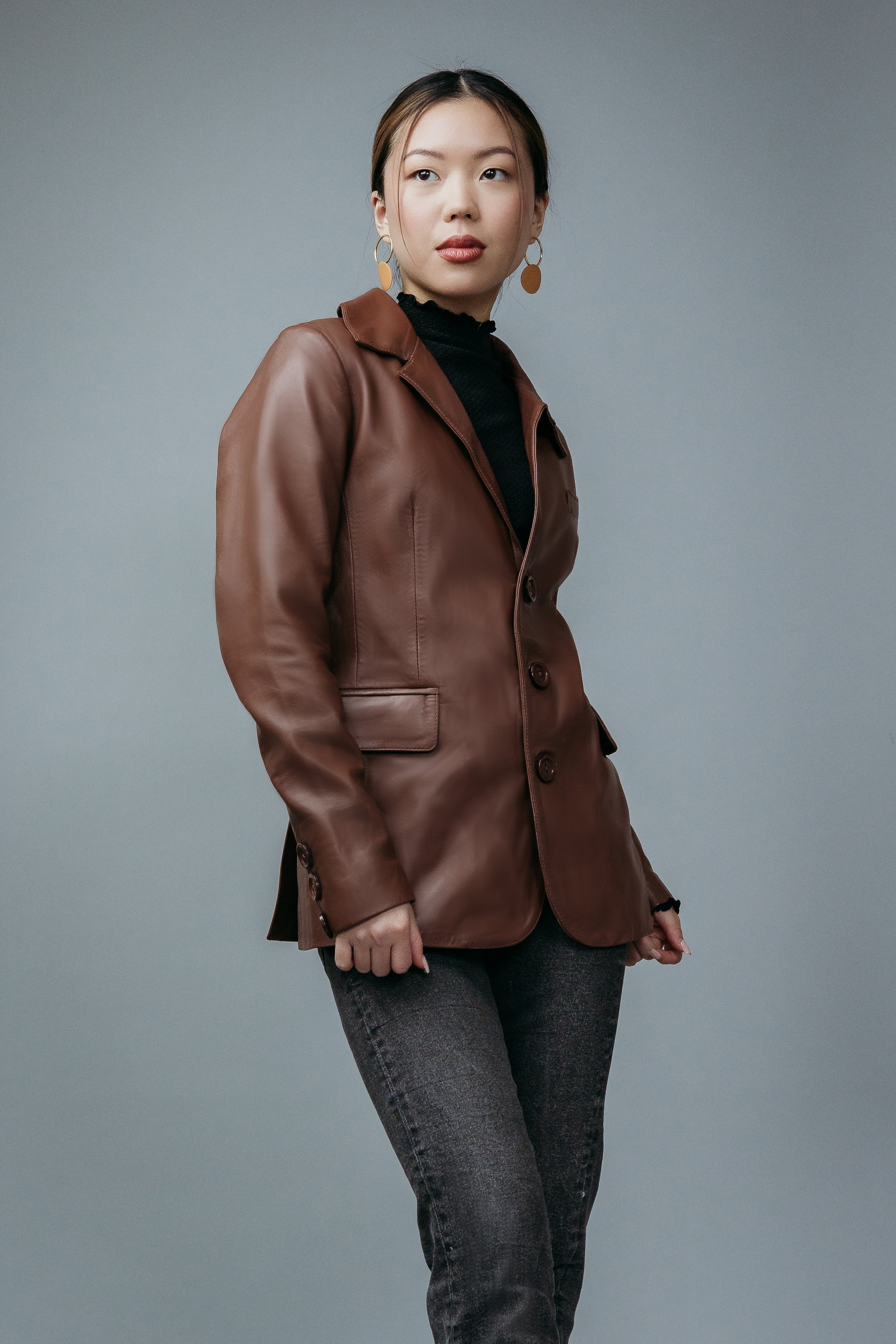 Women's Blazer Style Jacket made with Sheep Top Grain Nappa Leather in Brown Colour. Inner Lining is Silk Satin Material in Brown Colour. It has Brown Plastic Buttons.