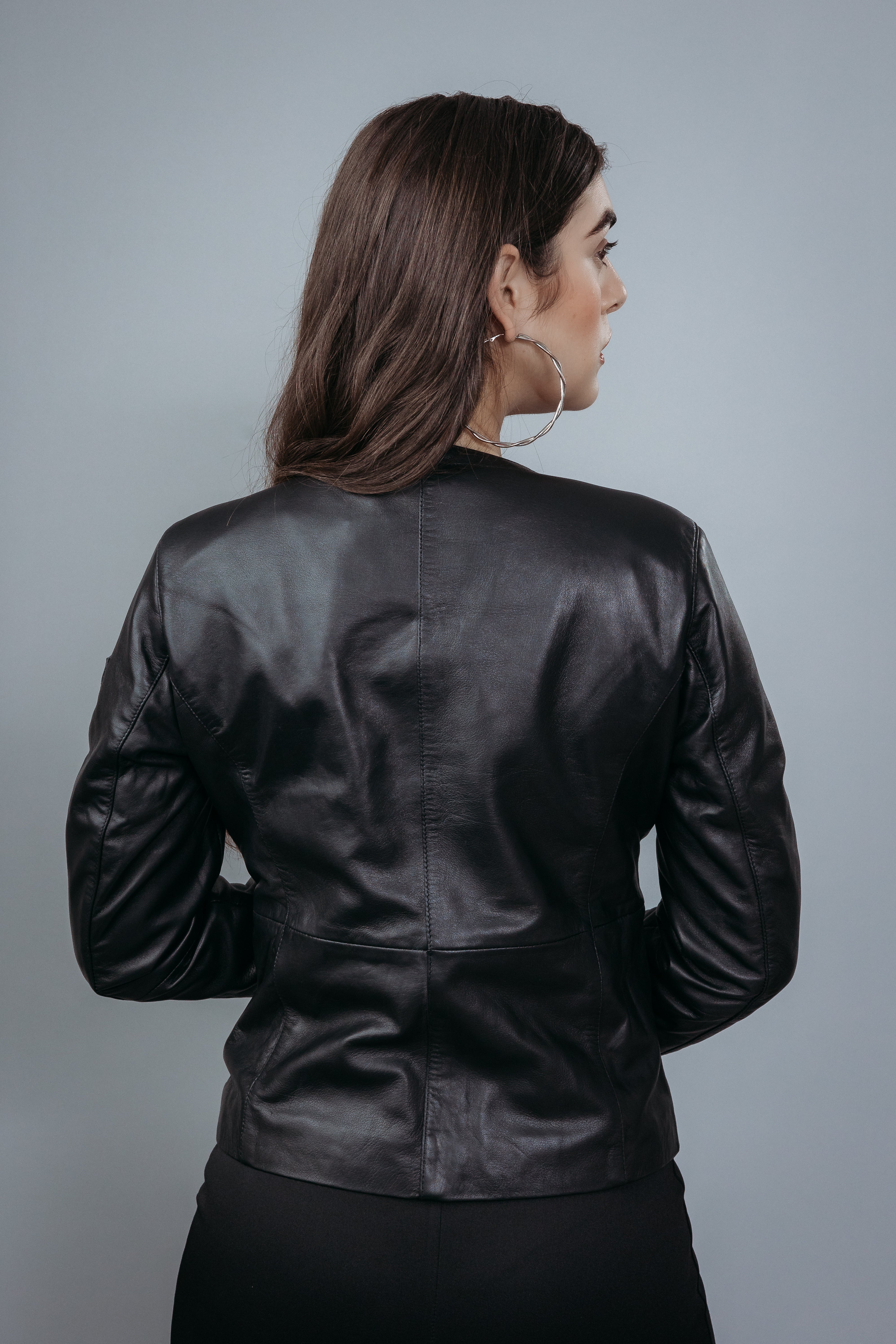 Women's Shirt Style Collarless Jacket made with Semi Aniline Sheep Leather in Black Colour. Inner Lining is Silk Satin Material in Black Colour. It has Black and Silver Trim.