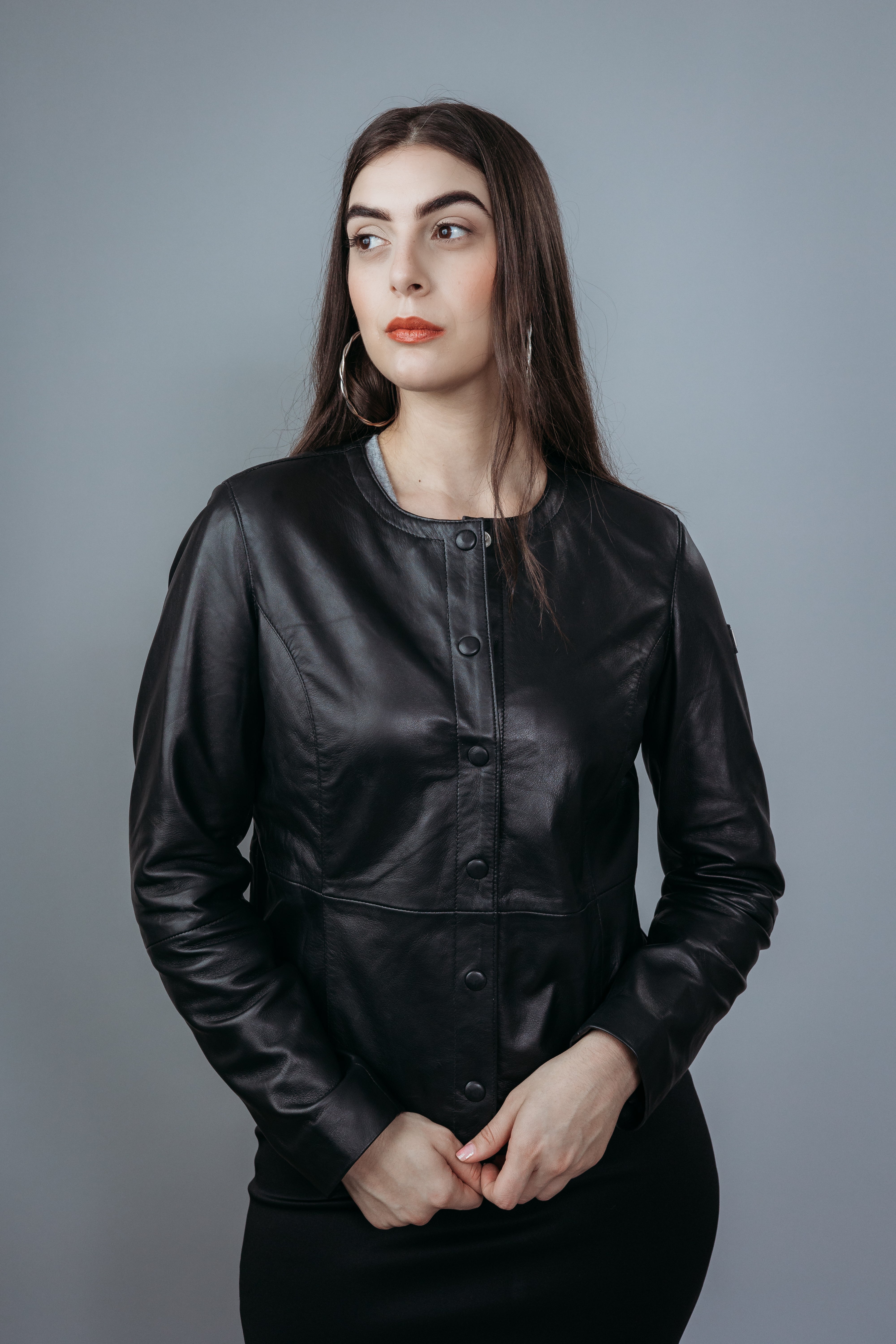 Women's Shirt Style Collarless Jacket made with Semi Aniline Sheep Leather in Black Colour. Inner Lining is Silk Satin Material in Black Colour. It has Black and Silver Trim.