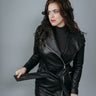 Women's Trench Coat made with Semi-Aniline Sheep Leather in Black Colour. Inner Lining is Silk Satin Material in Black Colour. It has Zipper and Matte Silver Trim.