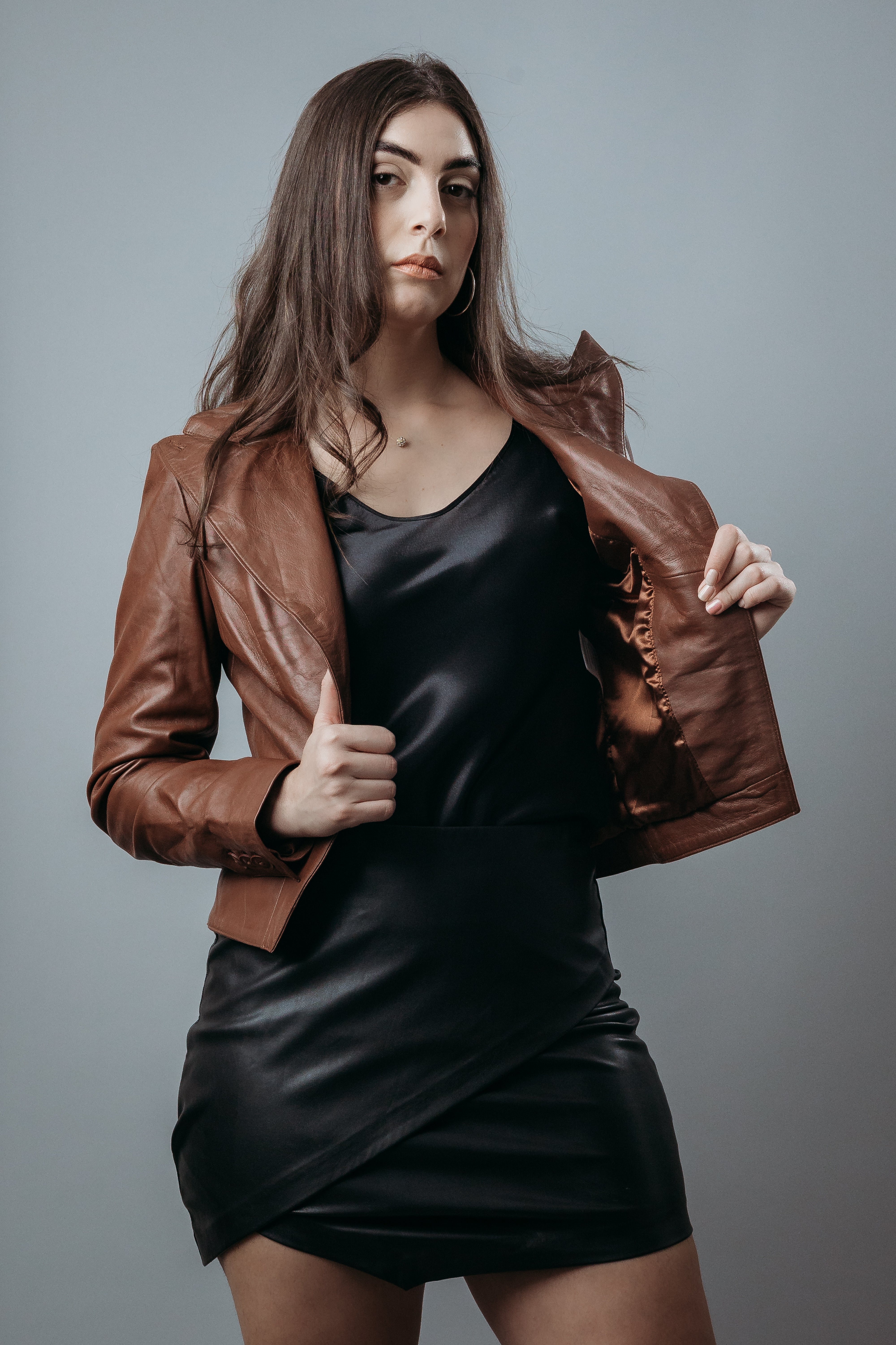 Women's Upper Style Short Jacket made with Sheep Top Grain Nappa Leather in Brown Colour. Inner Lining is Silk Satin Material in Brown Colour. It has Brown Plastic Buttons.