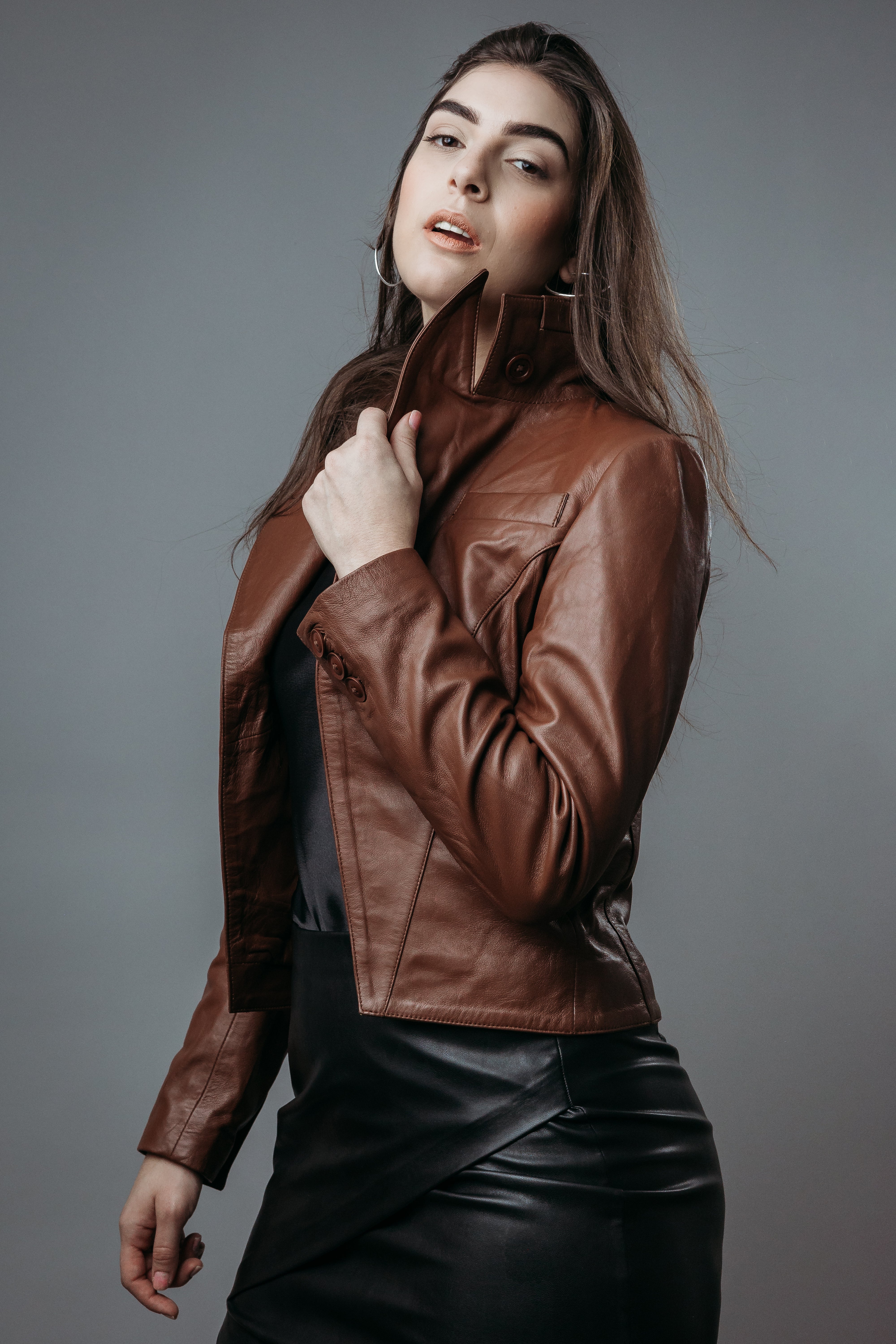 Women's Upper Style Short Jacket made with Sheep Top Grain Nappa Leather in Brown Colour. Inner Lining is Silk Satin Material in Brown Colour. It has Brown Plastic Buttons.