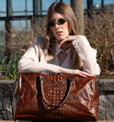 brown crocodile pattern leather duffel bag featured by women model