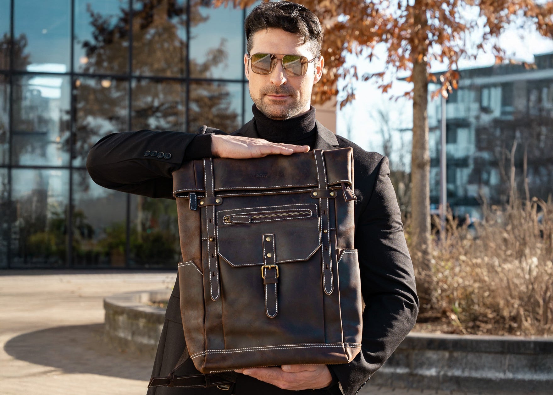 brown leather rolltop backpack featured by men model