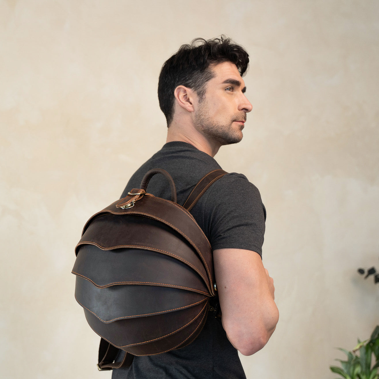brown leather backpack featured by men model