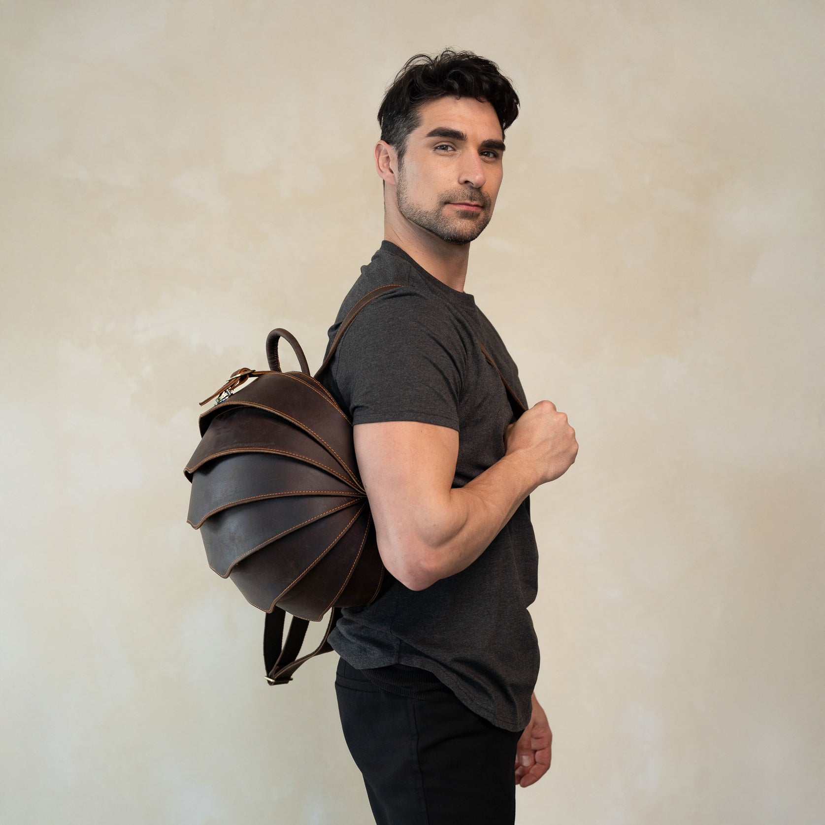 brown leather backpack featured by men model